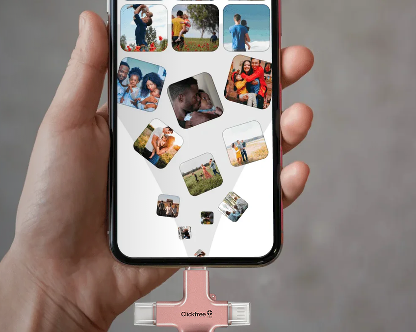 A hand holding a phone while photos flow into the Clickfree Pro